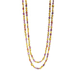 An appealing mogul Citrine and Tourmaline bead necklace strung on 60-inch- long silk with a small toggle clasp and 18-karat gold.