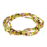 An amazing bead necklace creates a unique contrast of multicolored gemstones strung on silk with 18 karats of yellow gold.