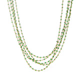 A precious Tsavorite bead necklace looks like a traditional royal with 5 strands of torsade and a circular diamond clasp.