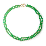 An alluring Chrysoprase two-strand green bead necklace with roundel diamond clasp with 18 karats yellow gold on 22-inch-long silk.