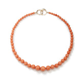 Embellished with perfectly round Salmon Coral 190 carat beads of 18 inches tied with diamond set circular clasp.